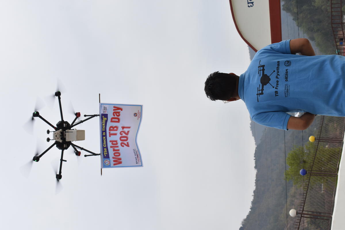 A BNMT drone operator flying a banner for World TB Day - Photo by Hem Tamang