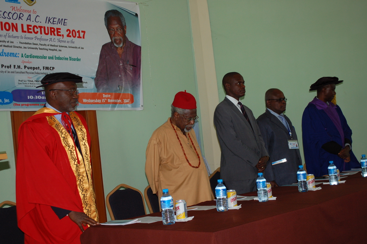 Prof Ikeme in red hat and guest lecturer, Prof Puepet Fabian, in red academic gown