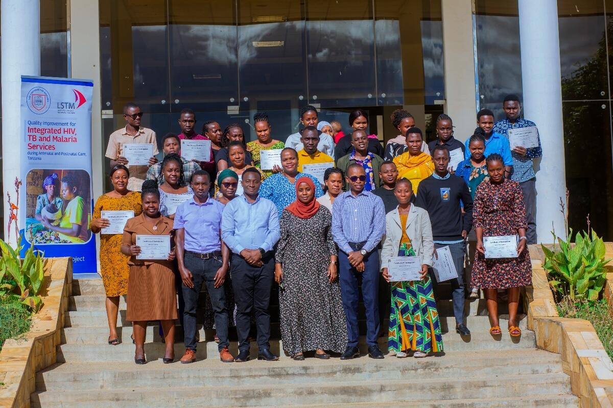 The last group of healthcare providers in a group photo with their facilitators after completing the QI course at the University of Dodoma on 5 April 5 2024 / Photo Credit UDOM