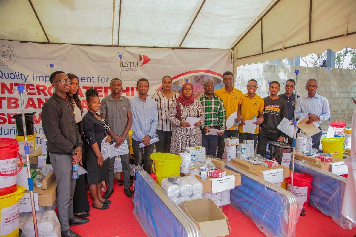 UDOM Project team members in a group photo with UDOM Health Club Members during a medical equipment donation event/Photo Credit UDOM