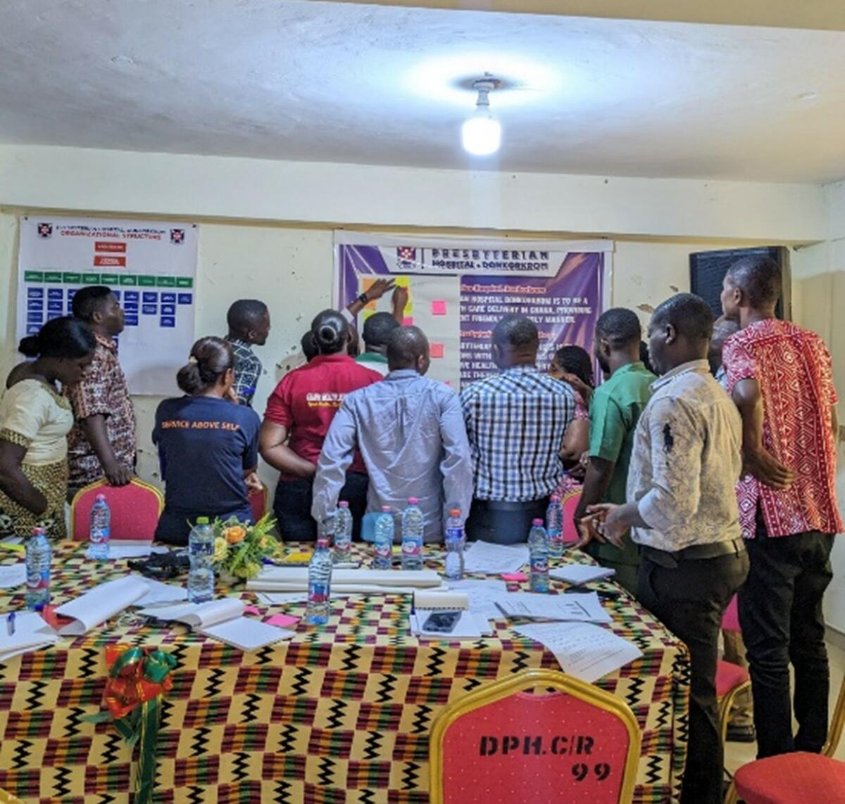 Figure 3. Betty and her Kwahu East team conducting a problem tree analysis during the workshop