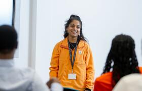 Photo of a a presenter at an LSTM Open Event