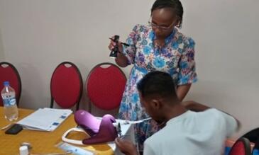 A trainer supporting a participant on insertion of post-partum intra-uterine device (PPIUD)/photo credit: LSTM Kenya