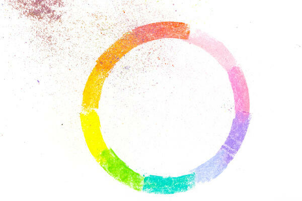 Circle drawn with colorful pastel chalks, on white background