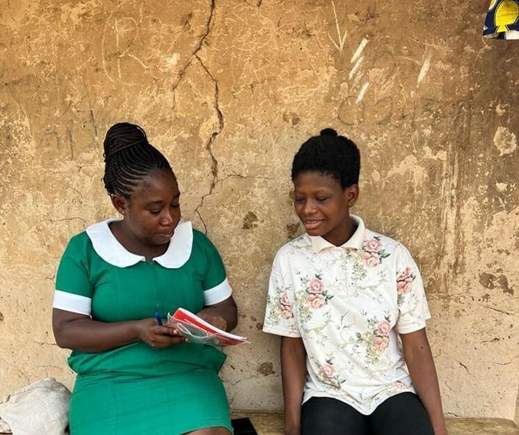 Betty with a patient in Kwahu East