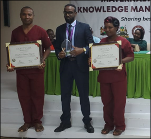Winners of Best mentor (male and female category) pause for a photo with the Medical Superintendent (Ijara Sub county hospital) while displaying their certificates of recognition and plaque. Winners of Best mentor (male and female category) pause for a photo with the Medical Superintendent (Ijara Sub county hospital) while displaying their certificates of recognition and plaque.