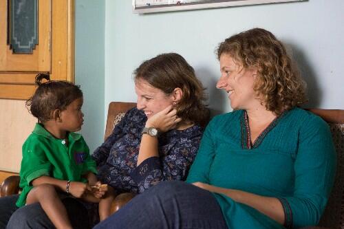 Dr Cat Morris (right) with Dr Mary Cusack and one of the children their NGO looks after in Odisha, India.