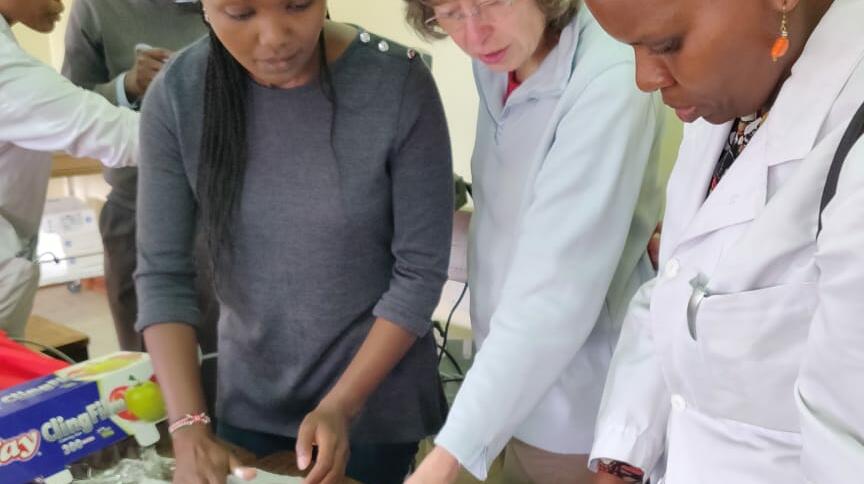 Wanjiku and Ingeborg using available resources to demonstrate the use of Ultrasound in vascular access and biopsy training (chicken breasts with olives hidden inside!) Wanjiku and Ingeborg using available resources to demonstrate the use of Ultrasound in vascular access and biopsy training (chicken breasts with olives hidden inside!)