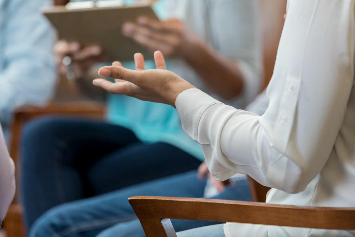 Image of a hand during a group therapy session