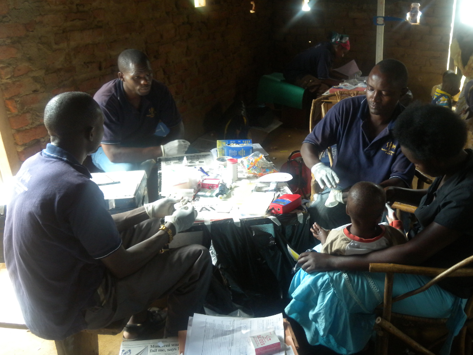 Blood samples being taken from a mother and child from Bukoba Village, Uganda