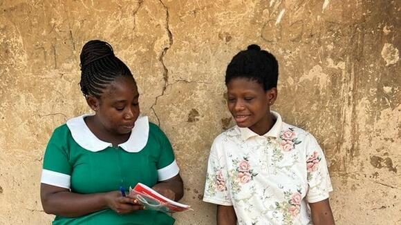 Betty with a patient in Kwahu East