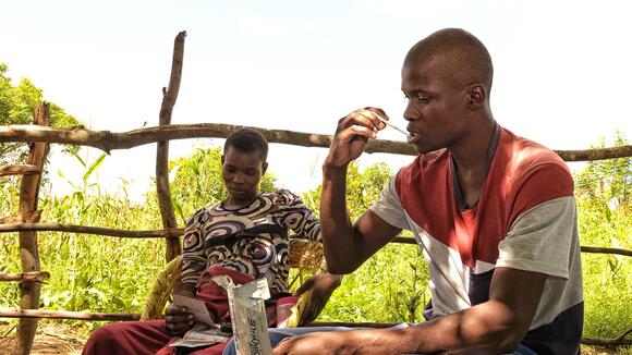 Man using HIV self-testing kit in Zimbabwe - photo credit: UNITAID